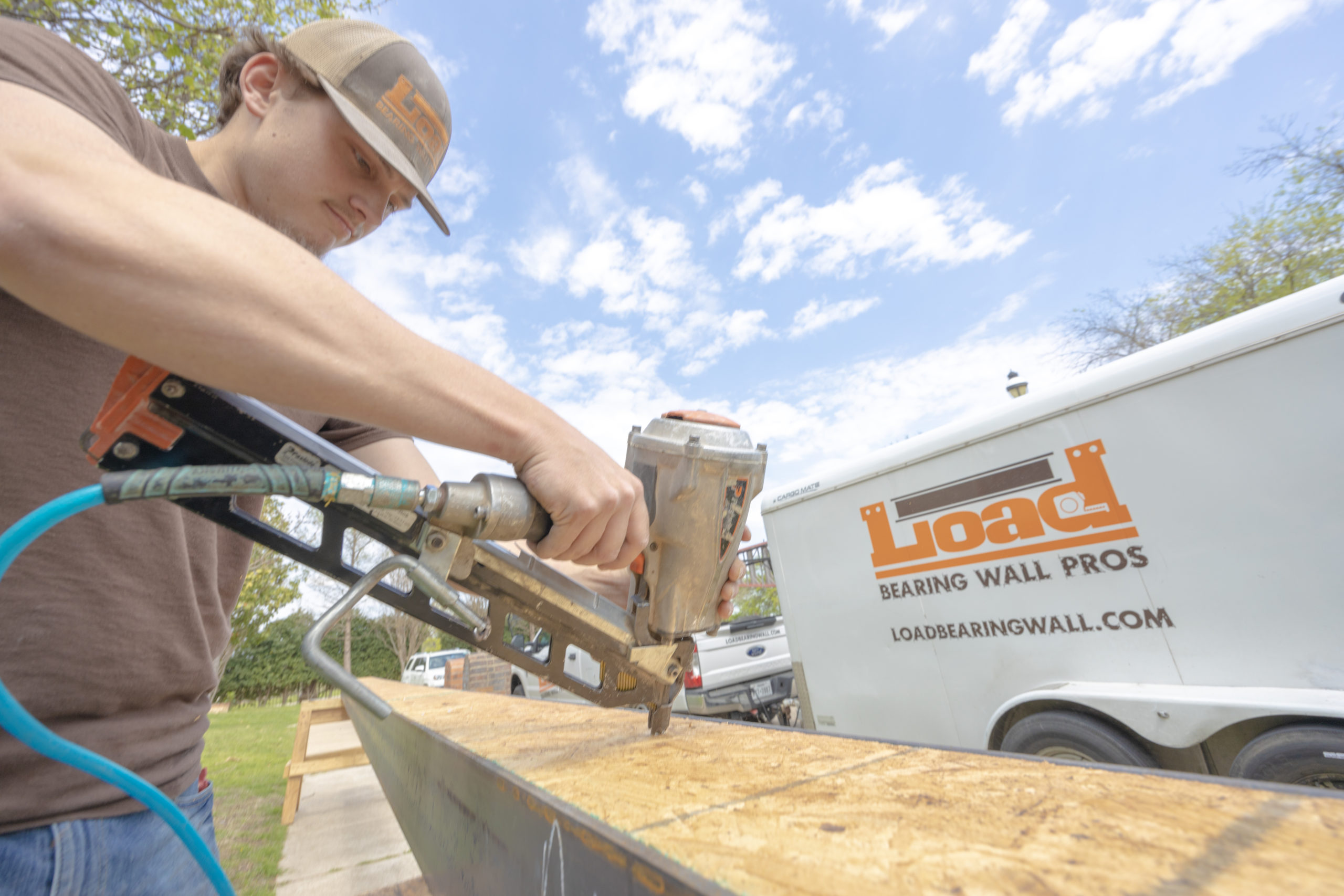Load bearing wall removal crew — structural support beam installation Texas