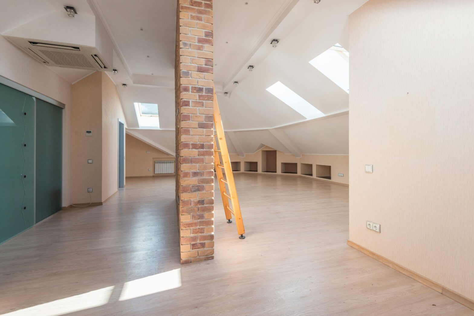 Open attic interior showcasing the additional space created through load bearing wall removal and structural modification.